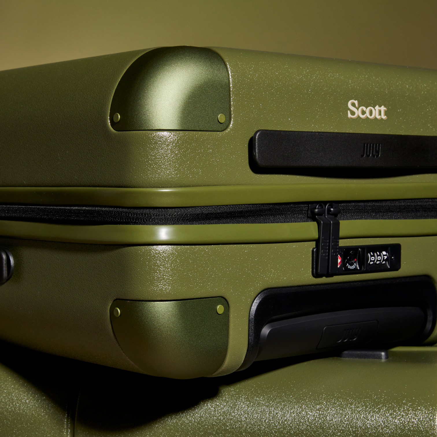 Personalised July luggage in moss