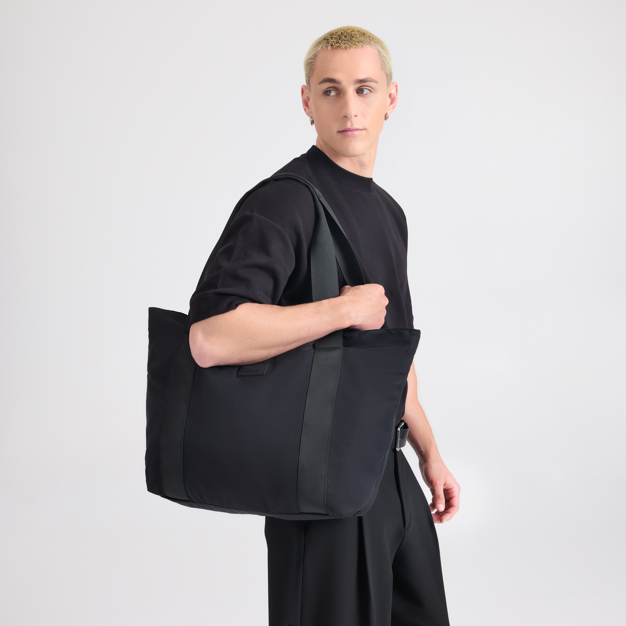 July travel tote worn on the shoulder