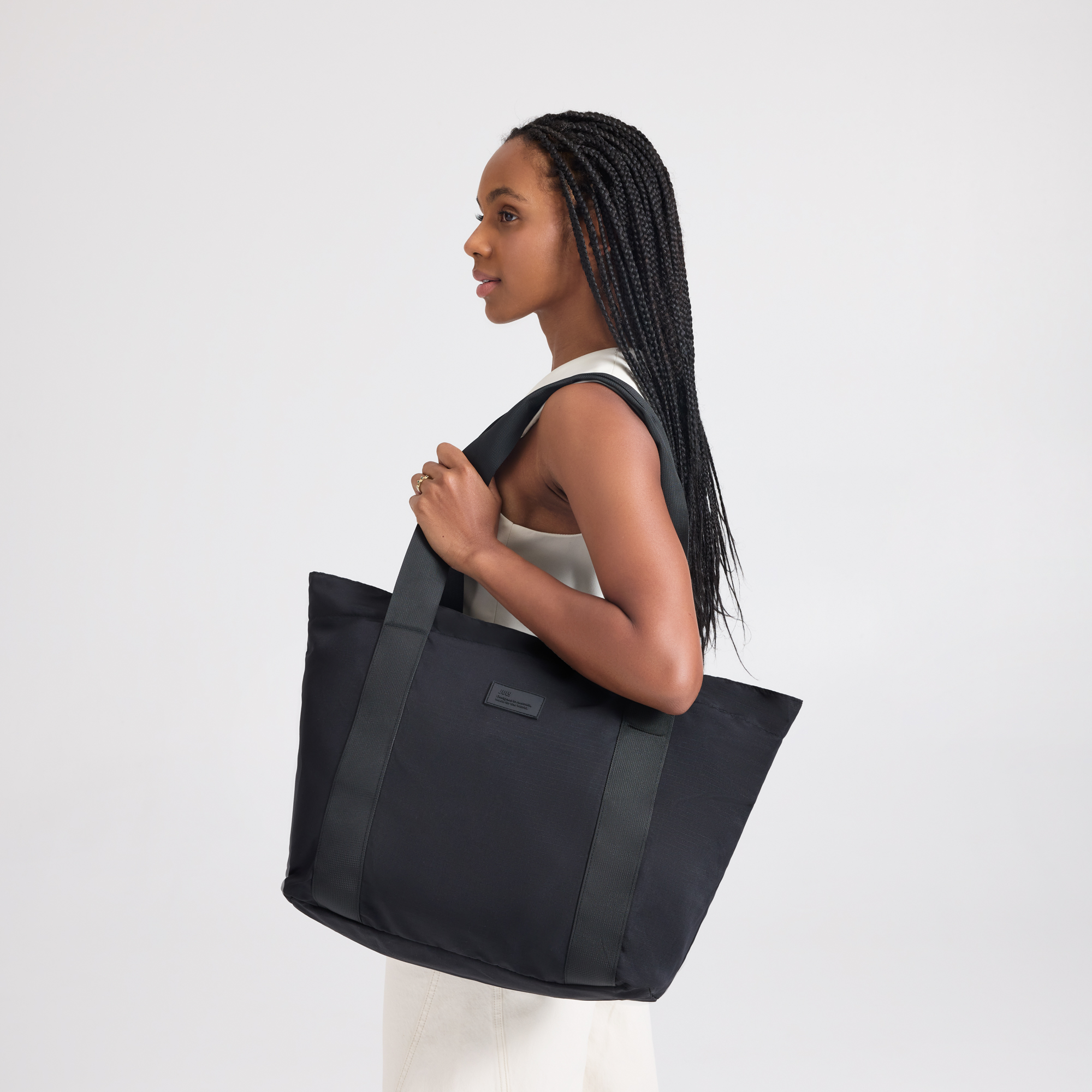 July travel tote carried over the shoulder